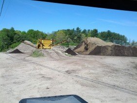 MELVILLE CONSTRUCTION LLC, green waste recycle, loam, mulch, sea shells - Photo 2